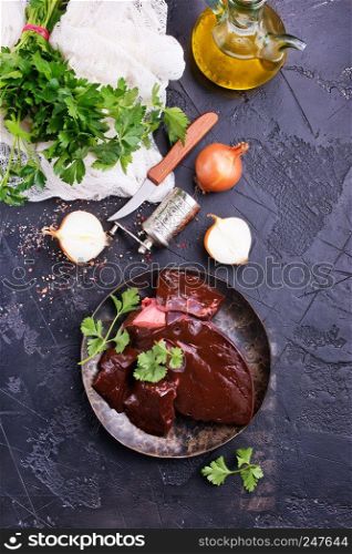 raw liver with aroma spice and salt on plate