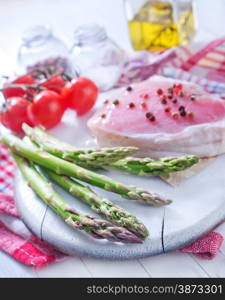 raw meat and asparagus