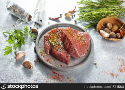 Raw meat beef steak organic fresh ingredient on gray plate