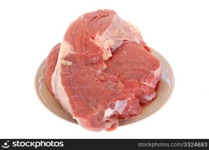 raw meat on a plate isolated on white background