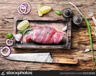 Raw meat on wooden cutting board. Raw beef meat on cutting board with spices
