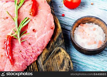 Raw meat selection. Raw beef fillet steaks with rosemary and spices.Raw meat