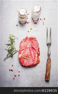 Raw meat Steak preparation on gray stone background, top view