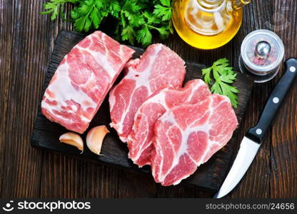 raw meat with aroma spice on a table