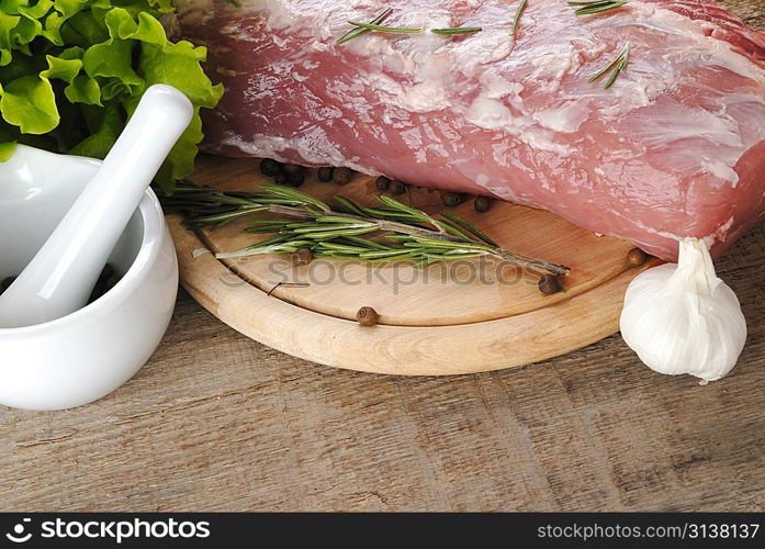 raw meat with lettuce and porcelain mortar