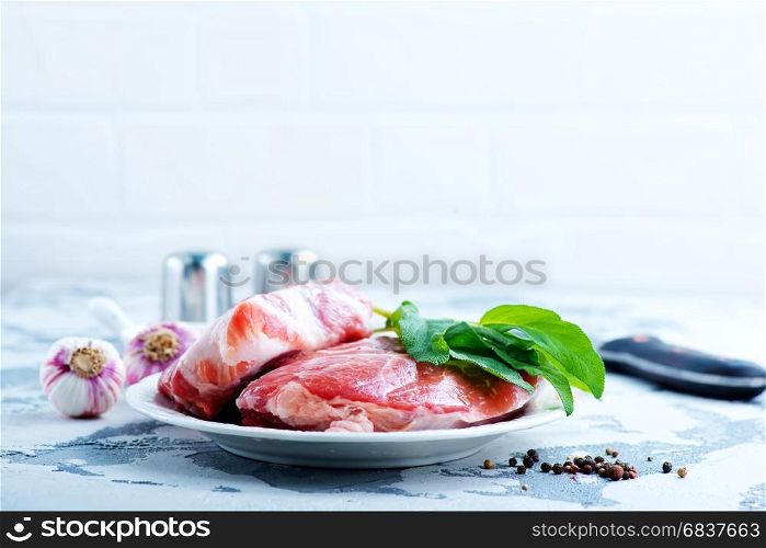 raw meat with pepper and salt on the plate