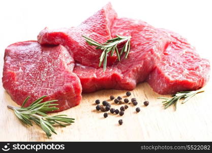 raw meat with rosemary