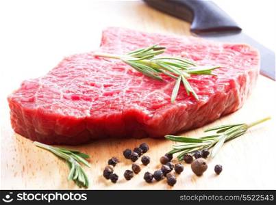 raw meat with rosemary
