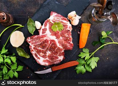 raw meat with salt and spice on a table