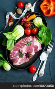 raw meat with spice and fresh vegetables