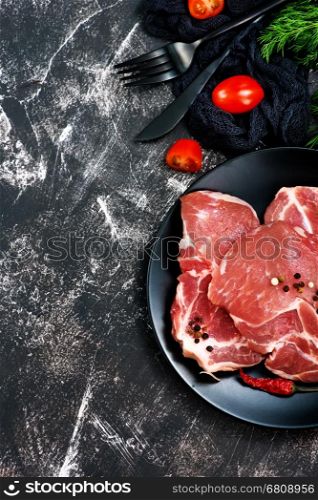 raw meat with spice and salt on a table