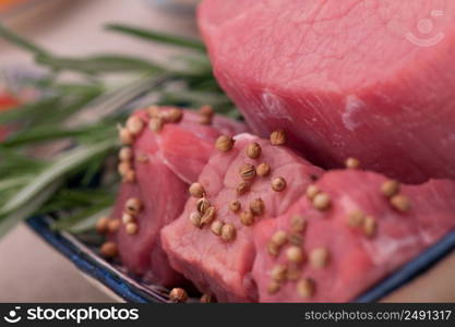 raw meat with spices and greens closeup. raw meat with spices