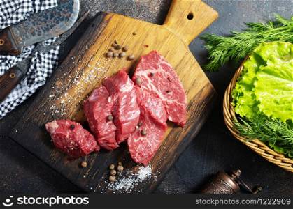 raw meat with spices and herbs on a table. Cooking meat. Raw meat. Healthy food concept