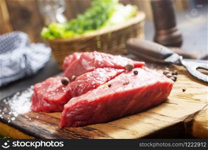 raw meat with spices and herbs on a table. Cooking meat. Raw meat. Healthy food concept