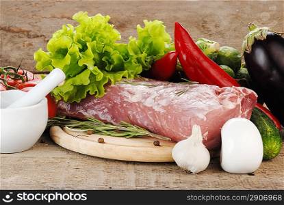raw meat with vegetables and porcelain mortar