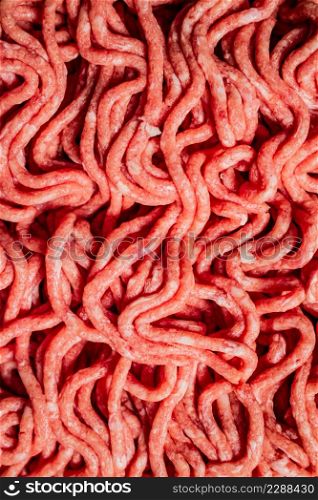 Raw minced fresh meat. Macro background. Texture of minced meat. High quality photo. Raw minced fresh meat. Macro background.