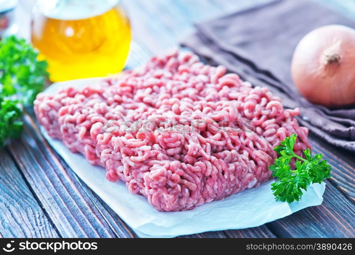 raw minced meat on the wooden board