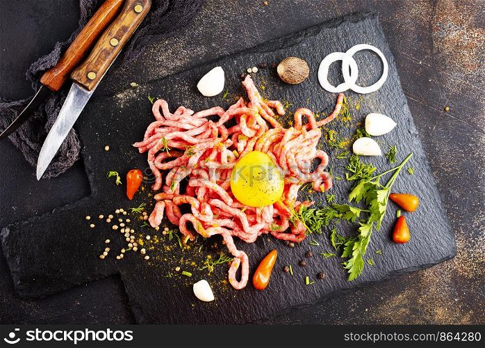 Raw minced meat with egg, herbs and spices