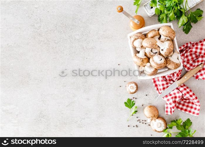 Raw mushrooms champignons on white background, cooking fresh champignons