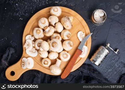 raw mushrooms on wooden board, Champignon mushrooms