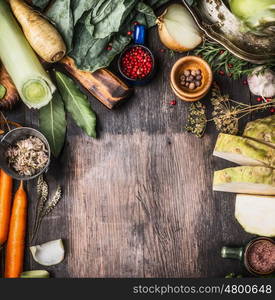 Raw organic vegetables ingredients for healthy cooking on rustic wooden background, top view, country food , frame