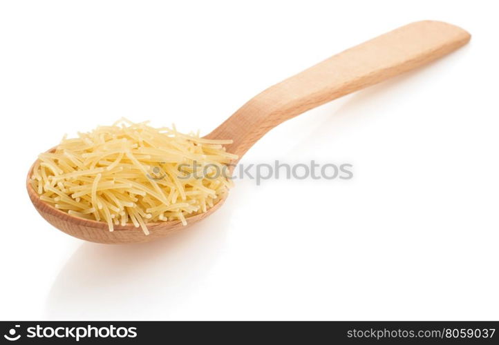 raw pasta in spoon isolated on white background