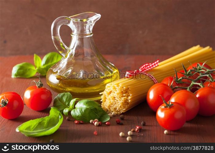 raw pasta olive oil tomatoes. italian cuisine in rustic kitchen