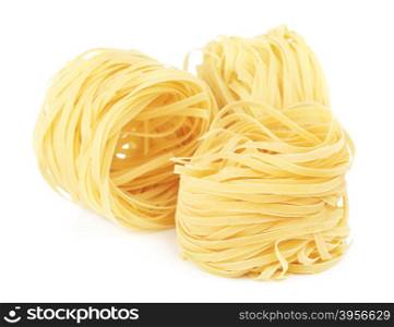 raw pasta tagliatelle nest, isolated on white