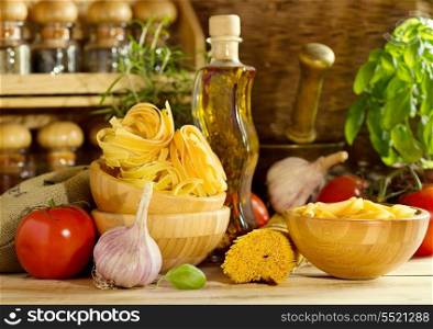 raw pasta with vegetables on wooden table