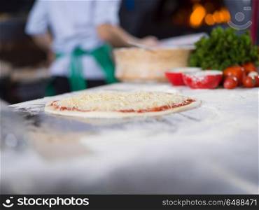 raw pizza margarita prepared for roasting. raw pizza margarita