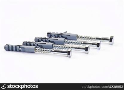 Raw plugs and bolts over white background