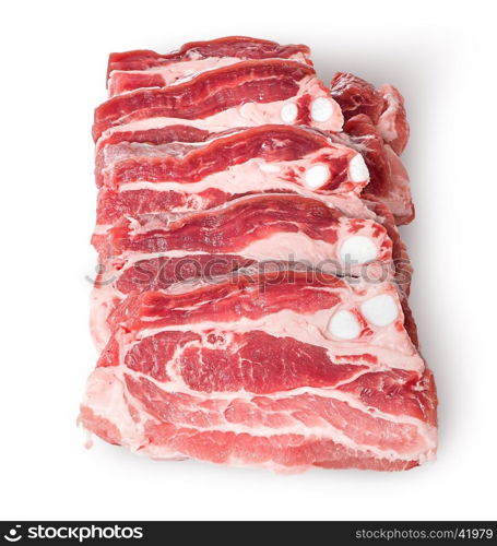 Raw pork belly slices in row isolated on white background