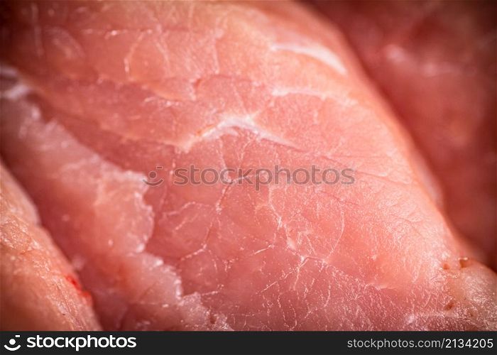 Raw pork. Macro background. The texture of the meat. High quality photo. Raw pork. Macro background. The texture of the meat.