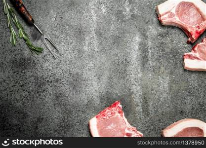 Raw pork steak. On rustic background. Raw pork steak.
