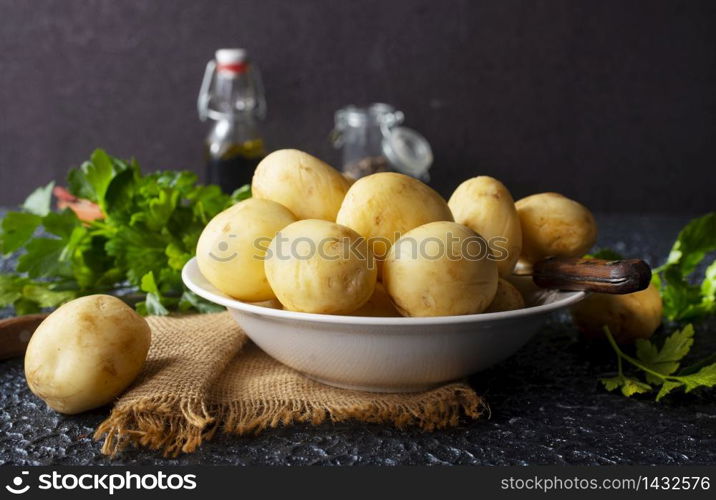 Raw potato, potato in bowl, raw potato for baking