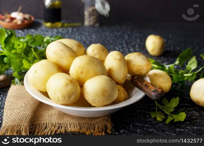 Raw potato, potato in bowl, raw potato for baking