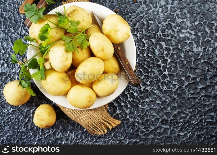 Raw potato, potato in bowl, raw potato for baking
