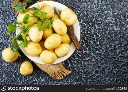 Raw potato, potato in bowl, raw potato for baking