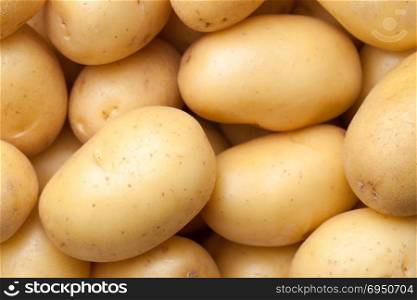 Raw potatoes background. Top view