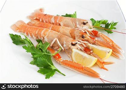 raw prawns with lemon and parsley closeup