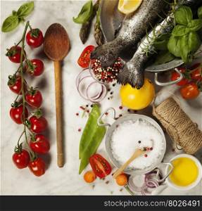 Raw rainbow trout with vegetables, herbs and spices - Health or Cooking concept