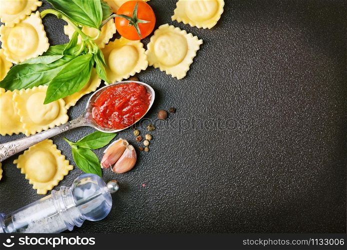 raw ravioli, tomato pasta and fresh basil
