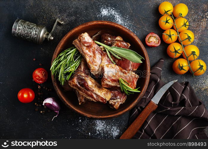 Raw ribs meat with herbs, salt, spices and other ingredients