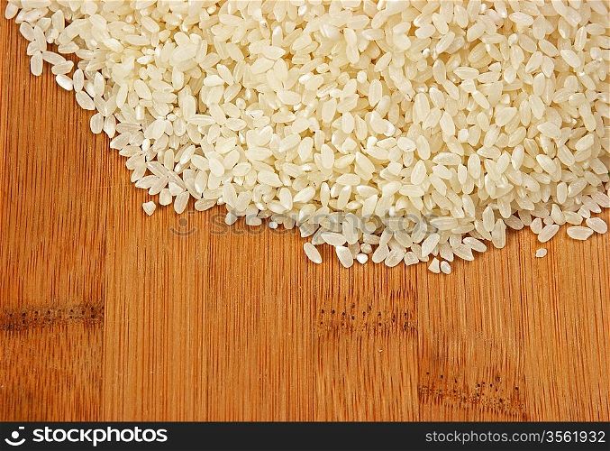 raw rice on bamboo board