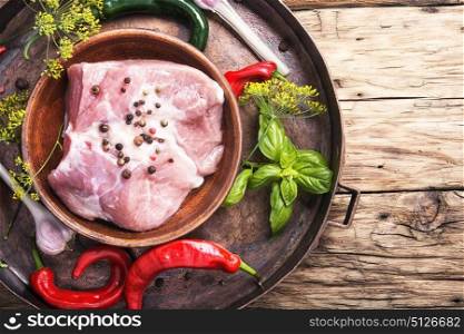 Raw rustic pork meat. Raw rustic pork meat with chili, spices and herbs