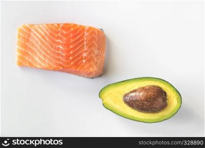 Raw salmon and avocado on the white background