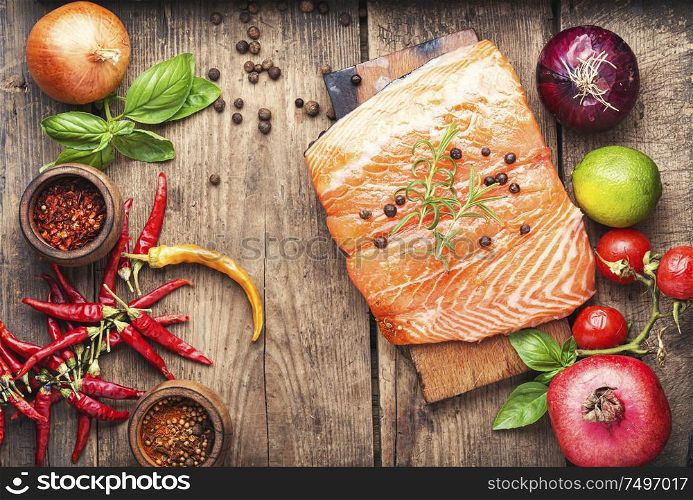 Raw salmon fillet on wooden cutting board. Fresh raw salmon fish