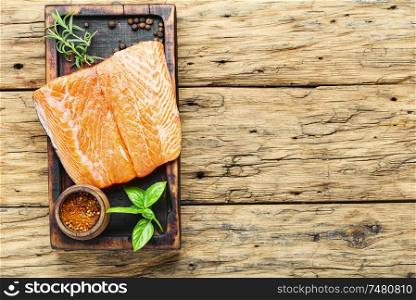 Raw salmon.Fresh salmon fillet on wooden cutting board. Fresh raw salmon fish