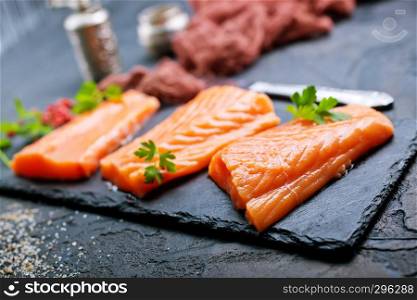 raw salmon with spice and salt on board