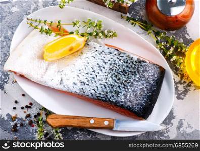 raw salmon with spice and salt on the plate